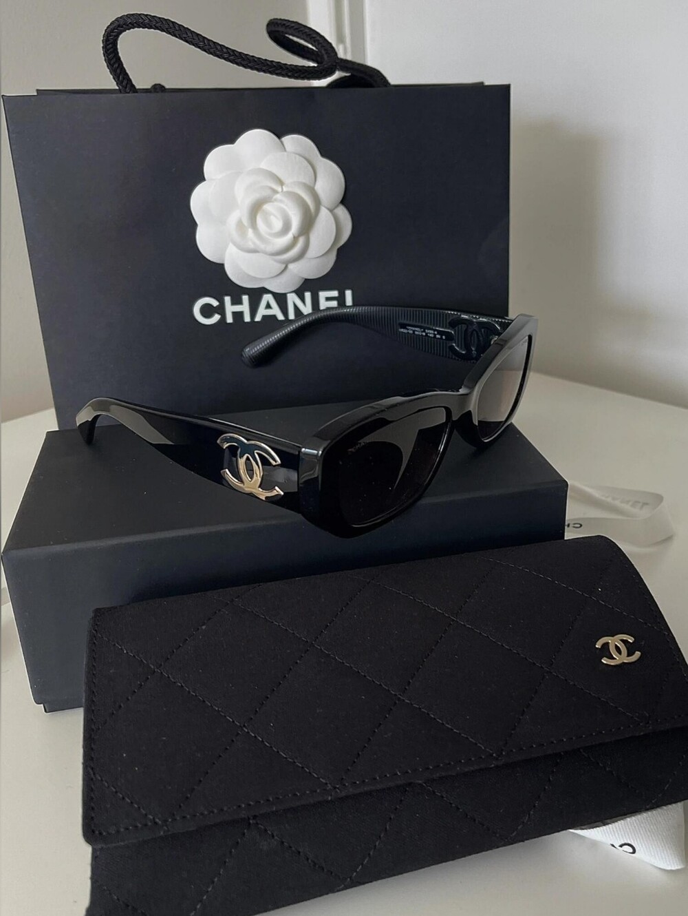 CHANEL Black Frame Sunglasses with Brown Tinted Lenses